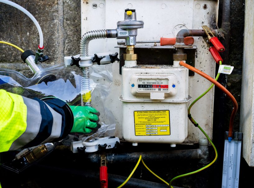 an engineer using servibag on a gas meter